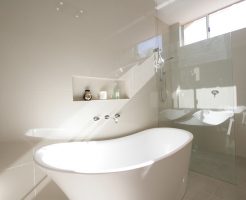 Sydney Bathroom Renovators - Small white and round bathtub in corner