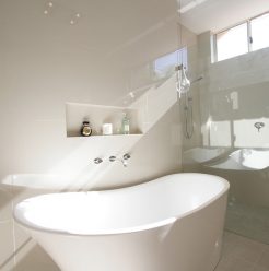 Sydney Bathroom Renovators - Small white and round bathtub in corner
