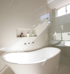 Sydney Bathroom Renovators - Small white and round bathtub in corner