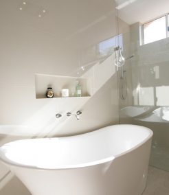 Sydney Bathroom Renovators - Small white and round bathtub in corner