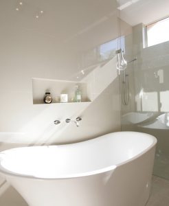 Sydney Bathroom Renovators - Small white and round bathtub in corner