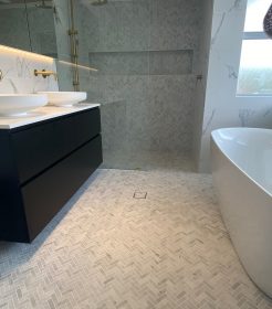 Herringbone and Marble Tile Elegant Bathroom Renovations Sutherland Shire