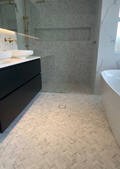 Herringbone and Marble Tile Elegant Bathroom Renovations Sutherland Shire